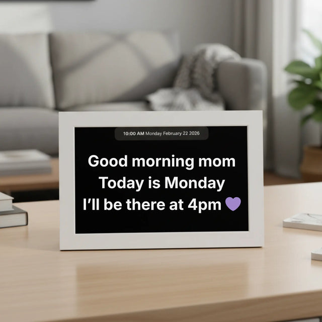 Memoryboard 10-inch digital message board displaying “Good morning mom. Today is Monday. I’ll be there at 4pm 💜” with date and time shown at the top.
