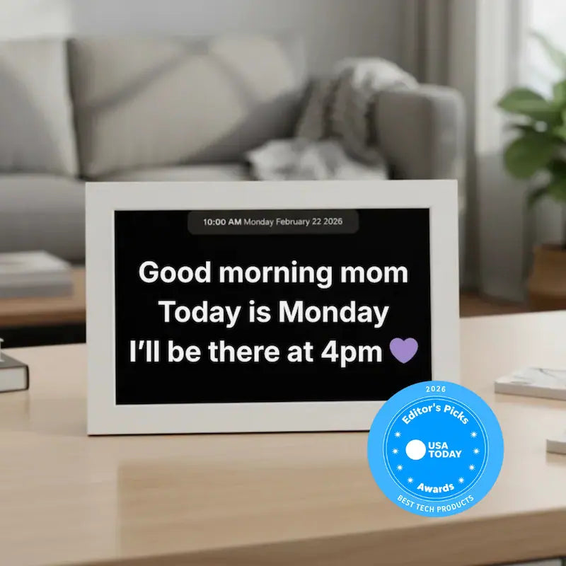 Memoryboard 10-inch digital message board displaying “Good morning mom. Today is Monday. I’ll be there at 4pm 💜” with date and time shown at the top.